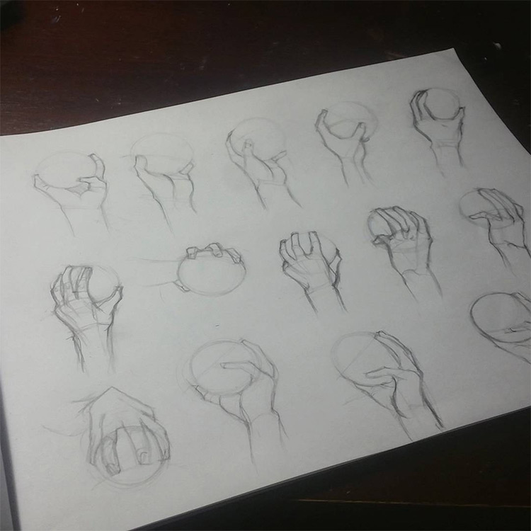 Drawings of hands holding balls