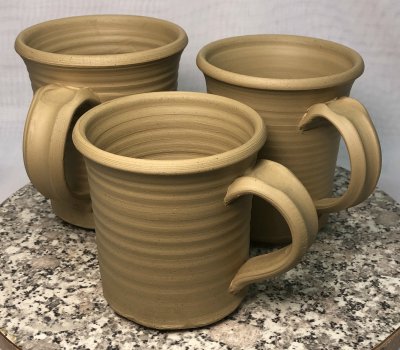 Two freshly thrown mugs made from pure Lincoln 60 fireclay